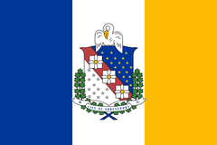 Flag of Shreveport, Louisiana: vertical bands of French blue, white and gold with the city shield